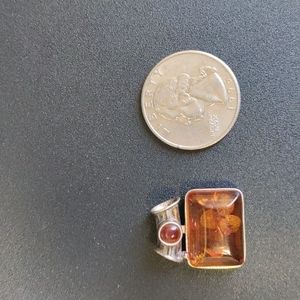Silver and amber necklace piece.